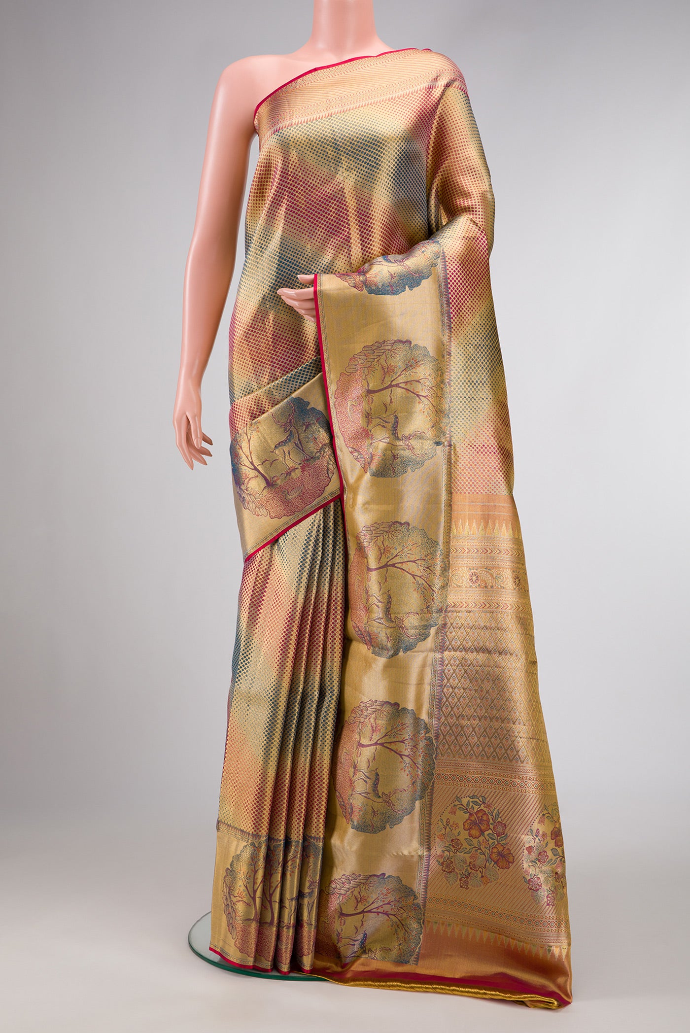 Gold Dual Tone Kanjivaram Tissue Silk Saree with Zari Brocade on the body and Fancy Border.  displayed on a mannequin
