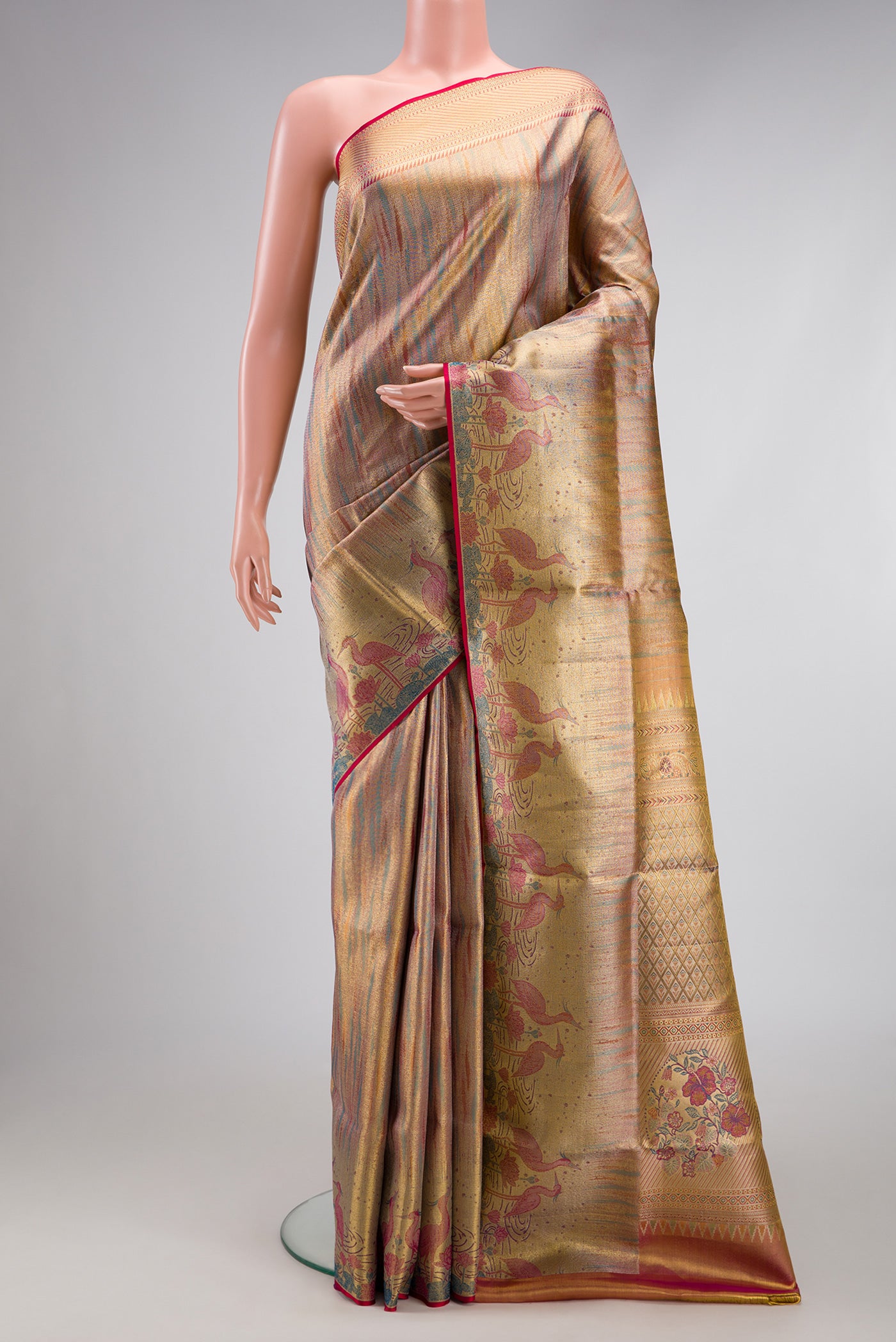 Rose Gold Dual Tone Kanjivaram Tissue Silk Saree with Zari Brocade on the body and Zari Border.  displayed on a mannequin