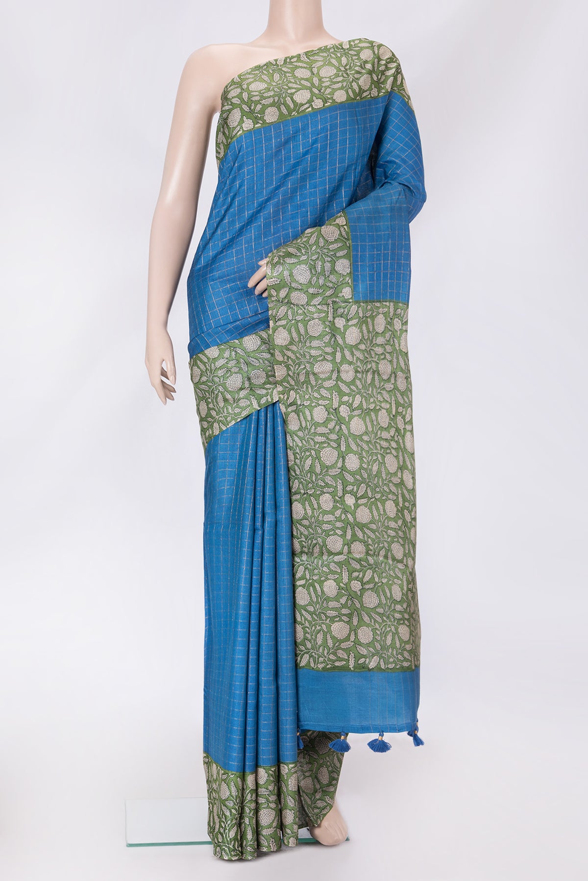Royal Blue Dual Tone Tussar Silk Saree with Checked design on the body and Printed Border.  displayed on a mannequin