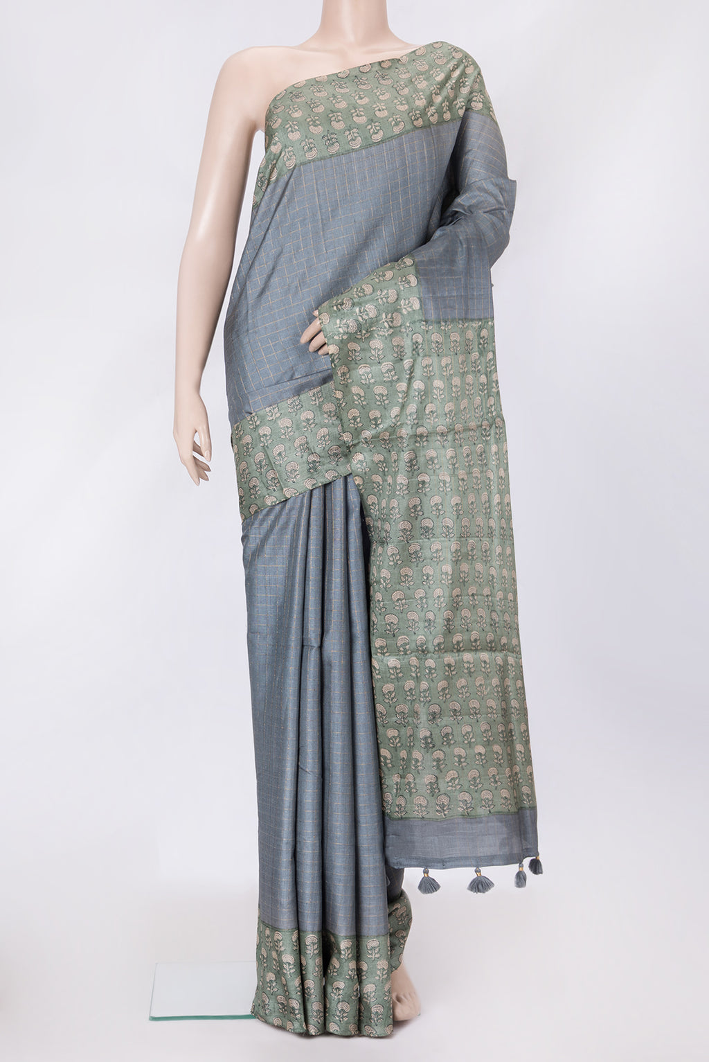 Grey Dual Tone Tussar Silk Saree with Checked design on the body and Printed Border.  displayed on a mannequin