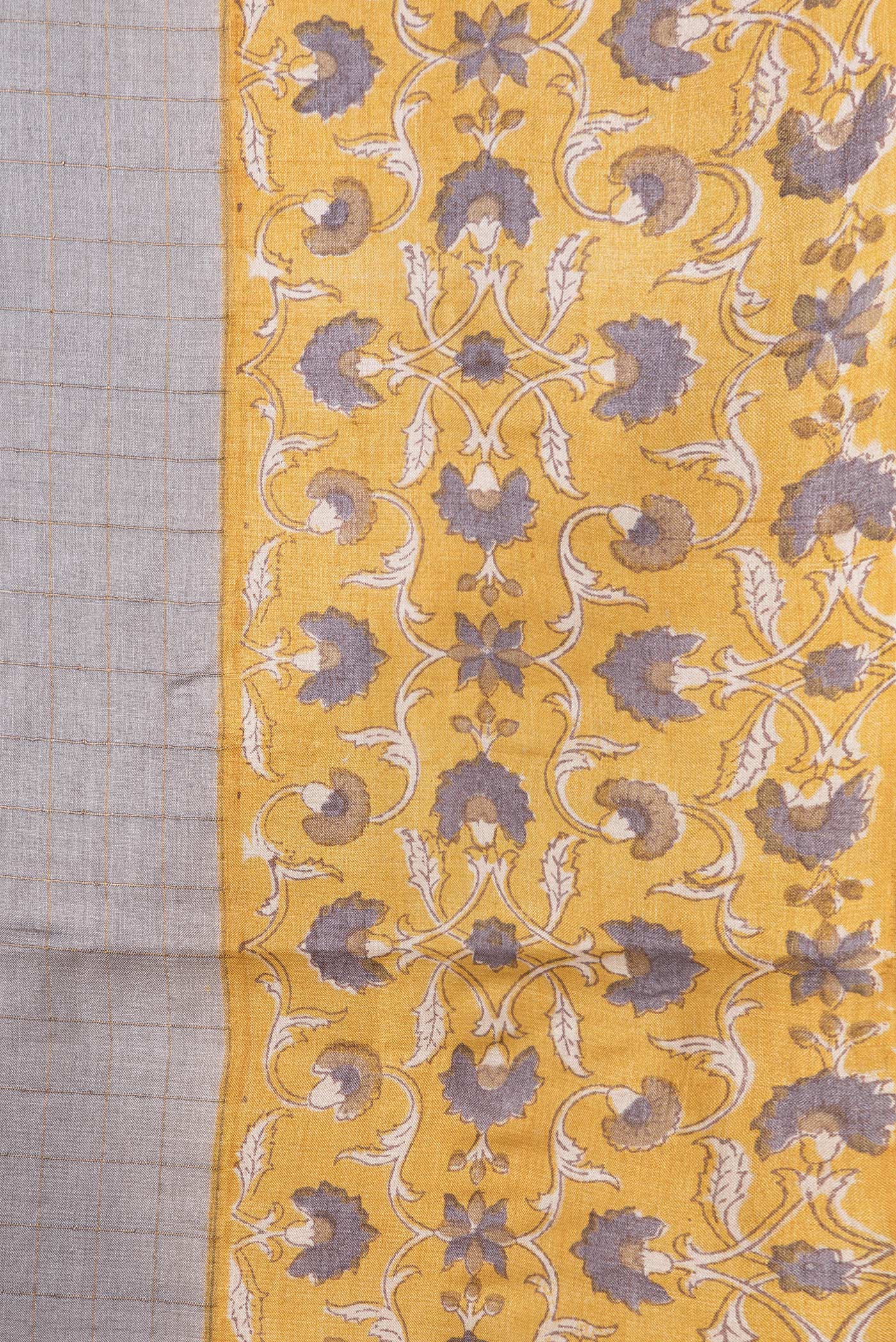 Border image of Grey Dual Tone Tussar Silk Saree with Checked design on the body and Printed Border. 