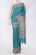 Sky Blue Dual Tone Tussar Silk Saree with Checked design on the body and Printed Border.  displayed on a mannequin