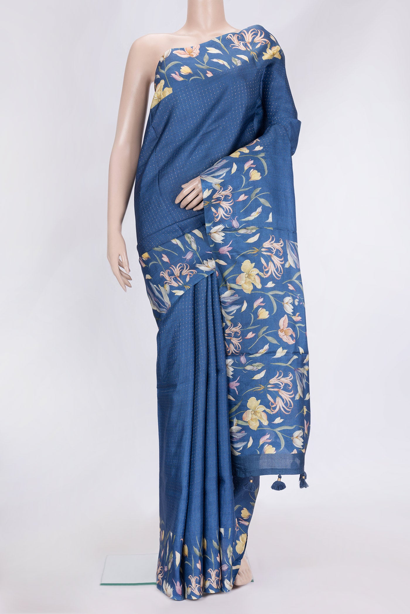 Blue Dual Tone Tussar Silk Saree with Zari Butta on the body and Printed Border.  displayed on a mannequin