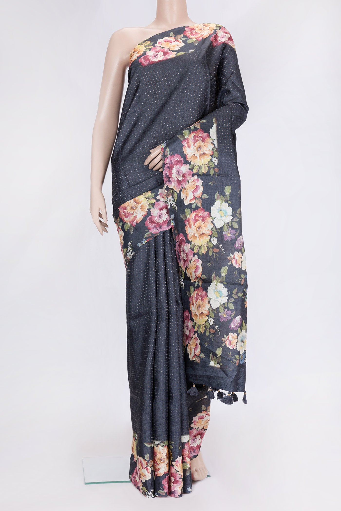 Black Dual Tone Tussar Silk Saree with Zari Butta on the body and Printed Border.  displayed on a mannequin