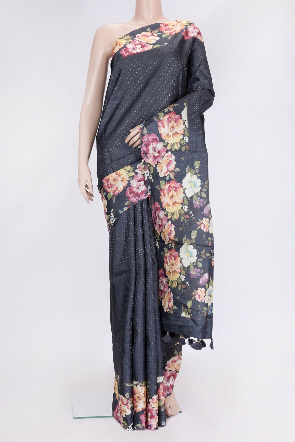 Black Dual Tone Tussar Silk Saree with Zari Butta on the body and Printed Border.  displayed on a mannequin