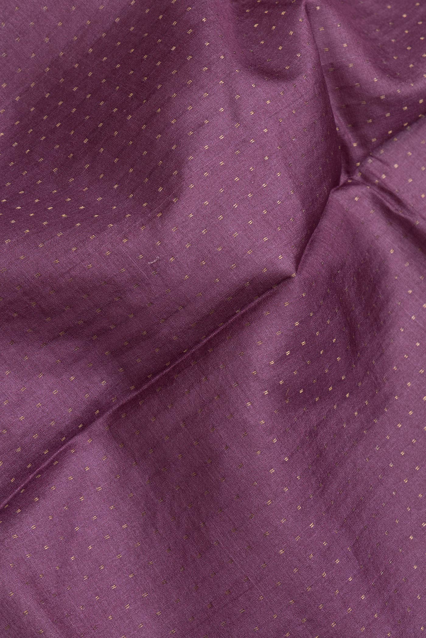 Close up of Pink Dual Tone Tussar Silk Saree with Zari Butta on the body and Printed Border.  displaying folds
