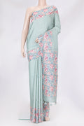 Light Blue Tussar Silk Saree with Stripes on the body and Printed Border.  displayed on a mannequin