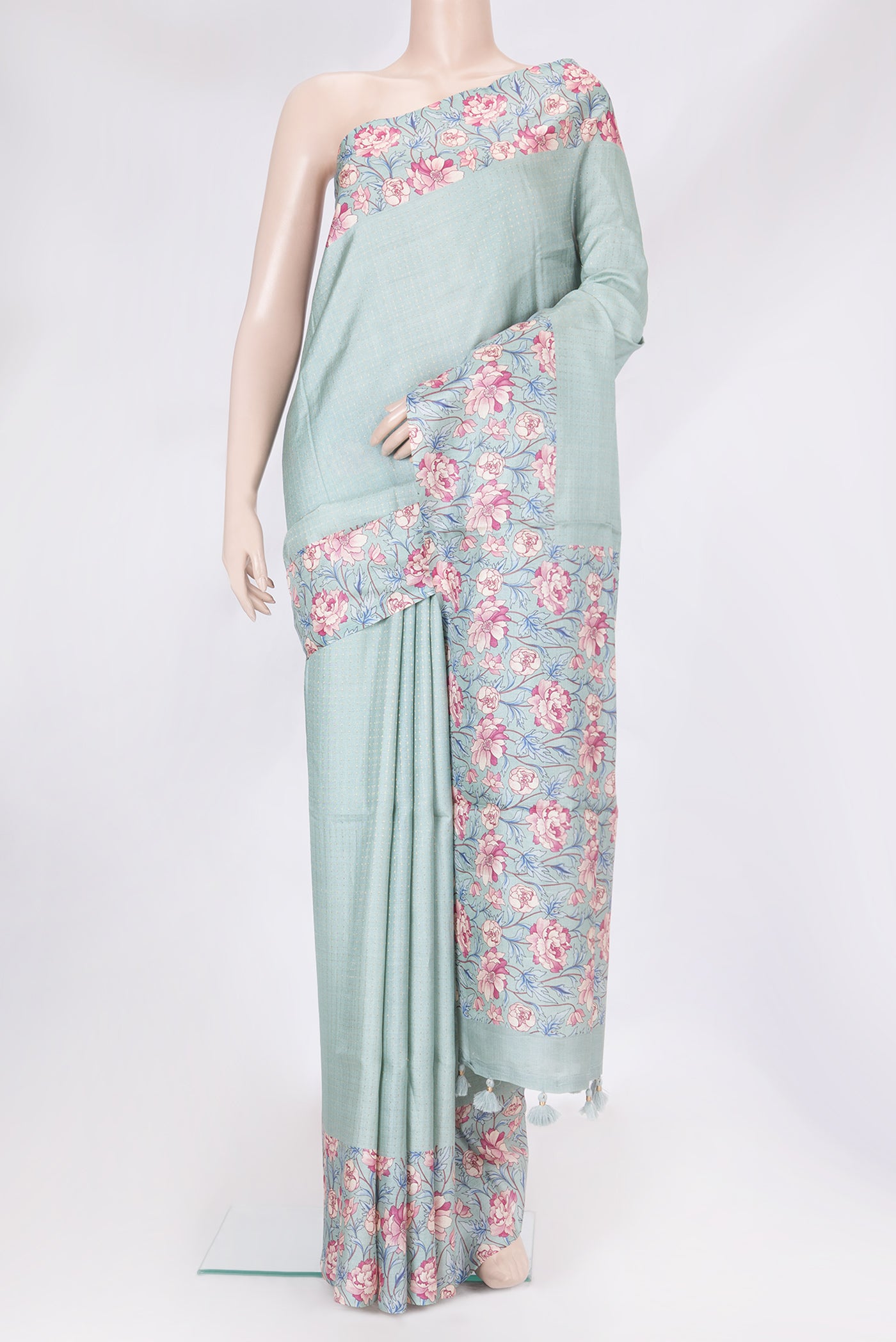 Light Blue Tussar Silk Saree with Stripes on the body and Printed Border.  displayed on a mannequin