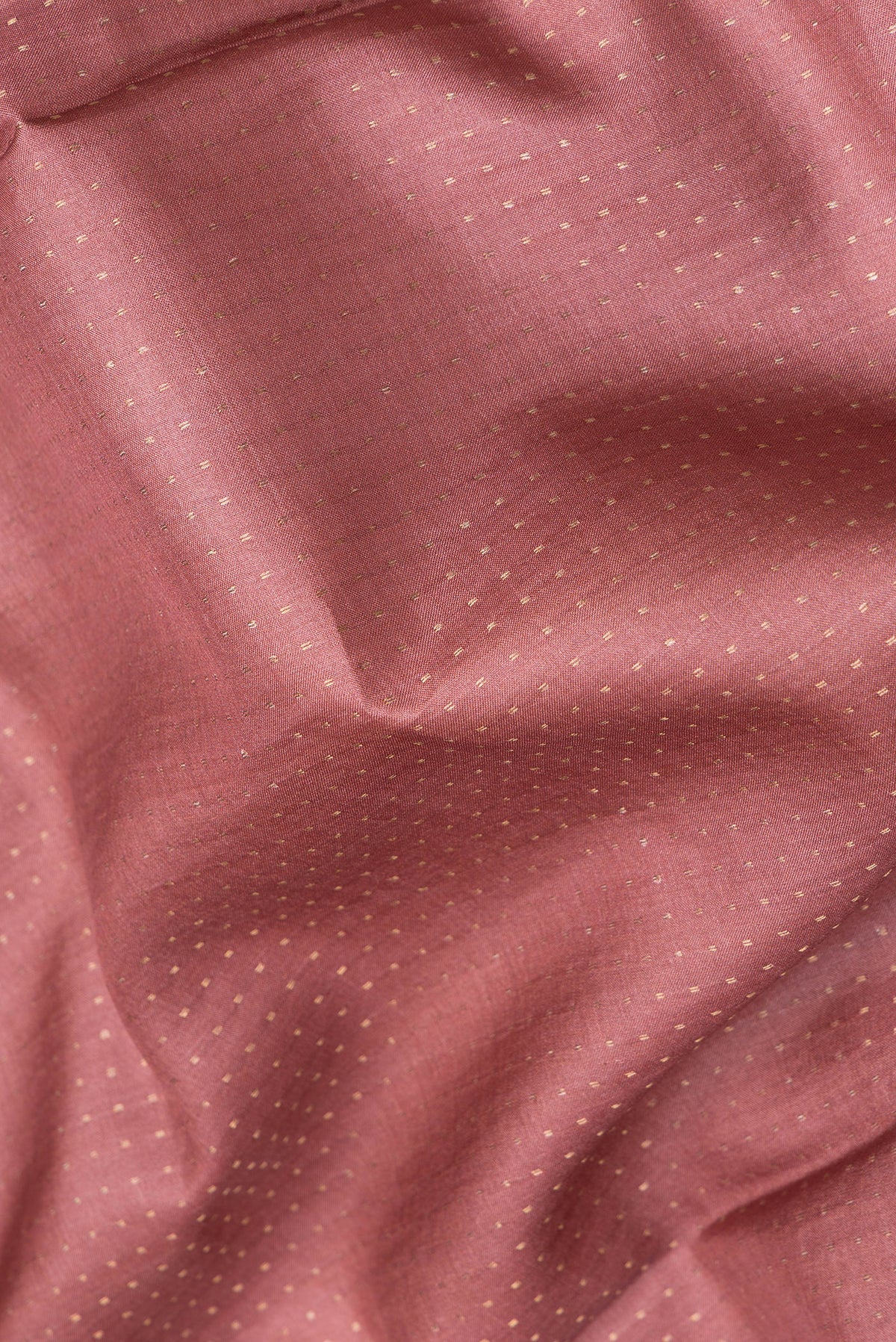 Close up of Mauve Dual Tone Tussar Silk Saree with Stripes on the body and Printed Border.  displaying folds