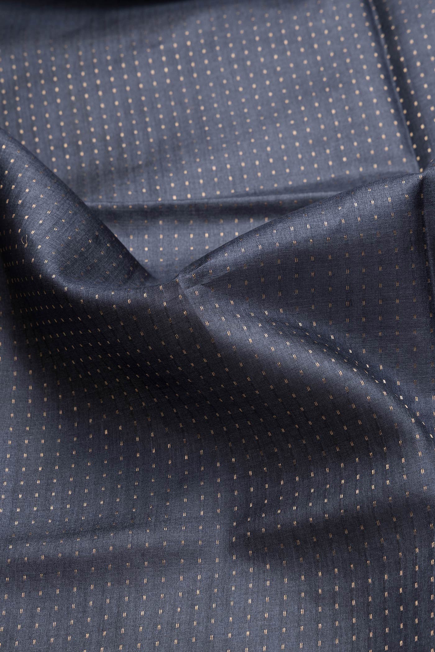 Close up of Navy Blue Dual Tone Tussar Silk Saree with Stripes on the body and Printed Border.  displaying folds