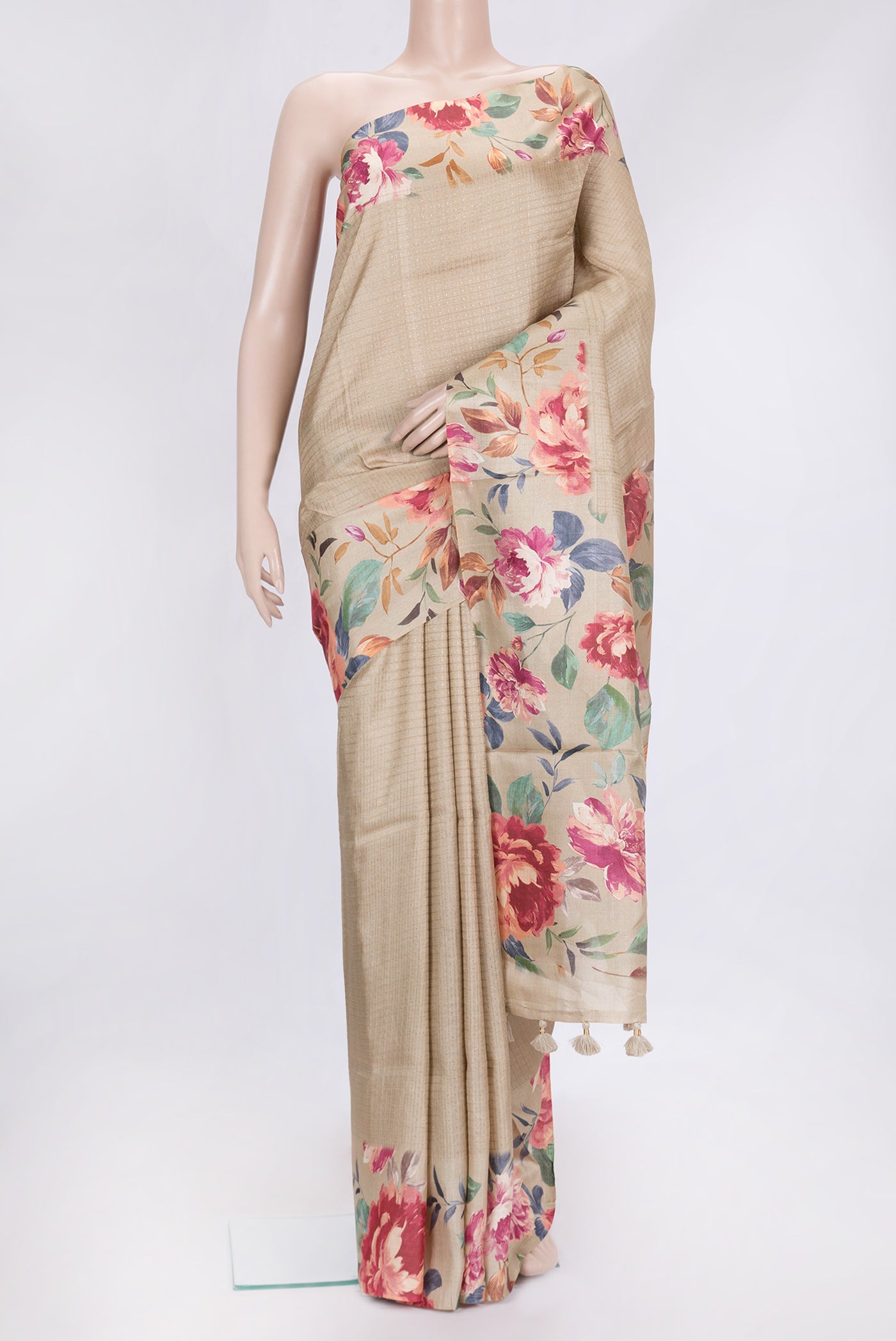 Beige Dual Tone Tussar Silk Saree with Zari Butta on the body and Printed Border.  displayed on a mannequin