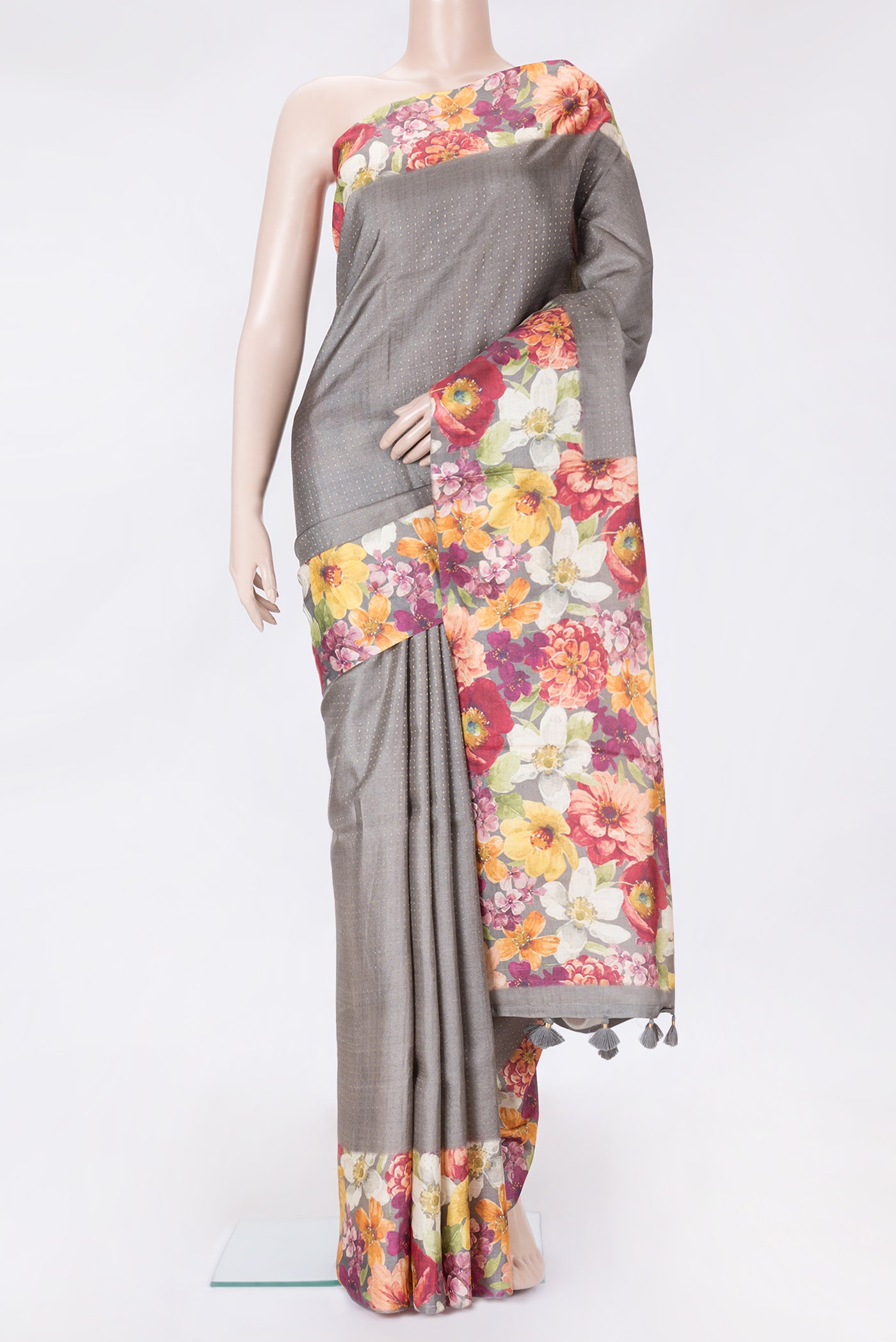 Grey Dual Tone Tussar Silk Saree with Stripes on the body and Printed Border.  displayed on a mannequin