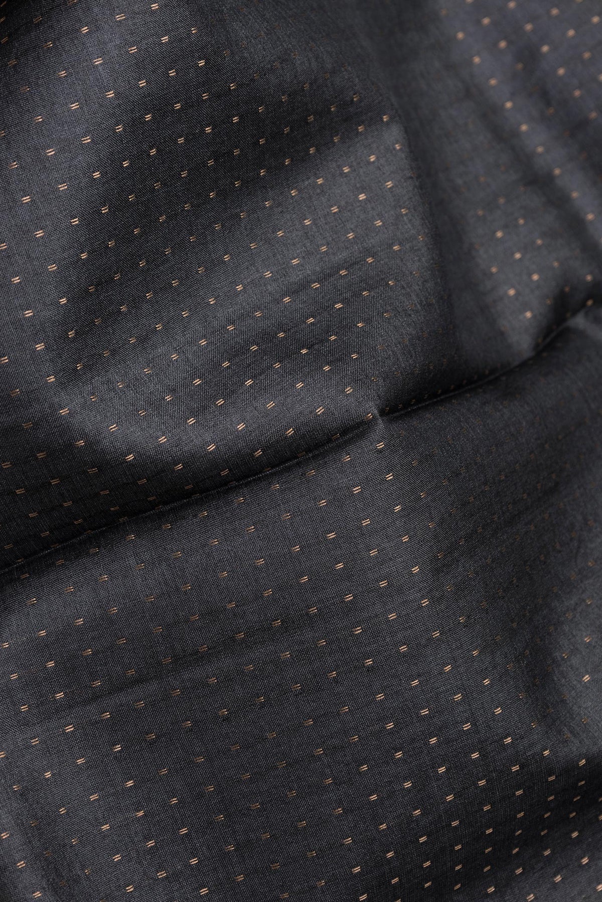 Close up of Black Dual Tone Tussar Silk Saree with Stripes on the body and Printed Border.  displaying folds