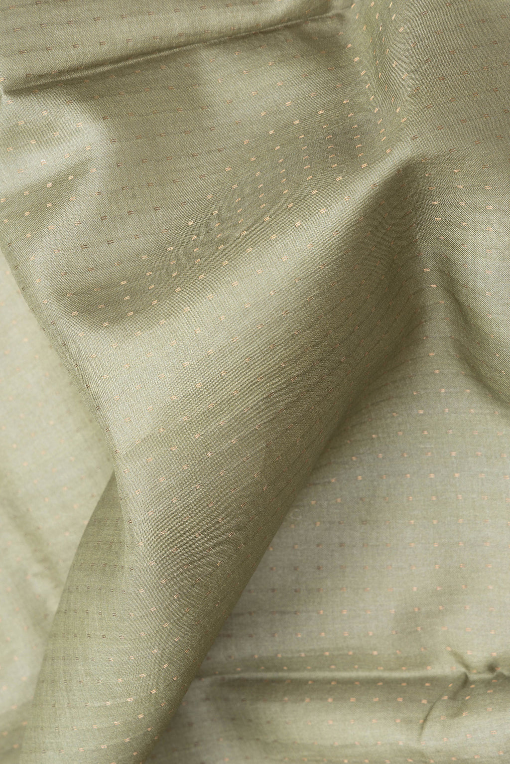 Close up of Sage Green Dual Tone Tussar Silk Saree with Stripes on the body and Zari Border.  displaying folds