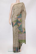 Beige Tussar Silk Saree with Printed design on the body and Fancy Border.  displayed on a mannequin