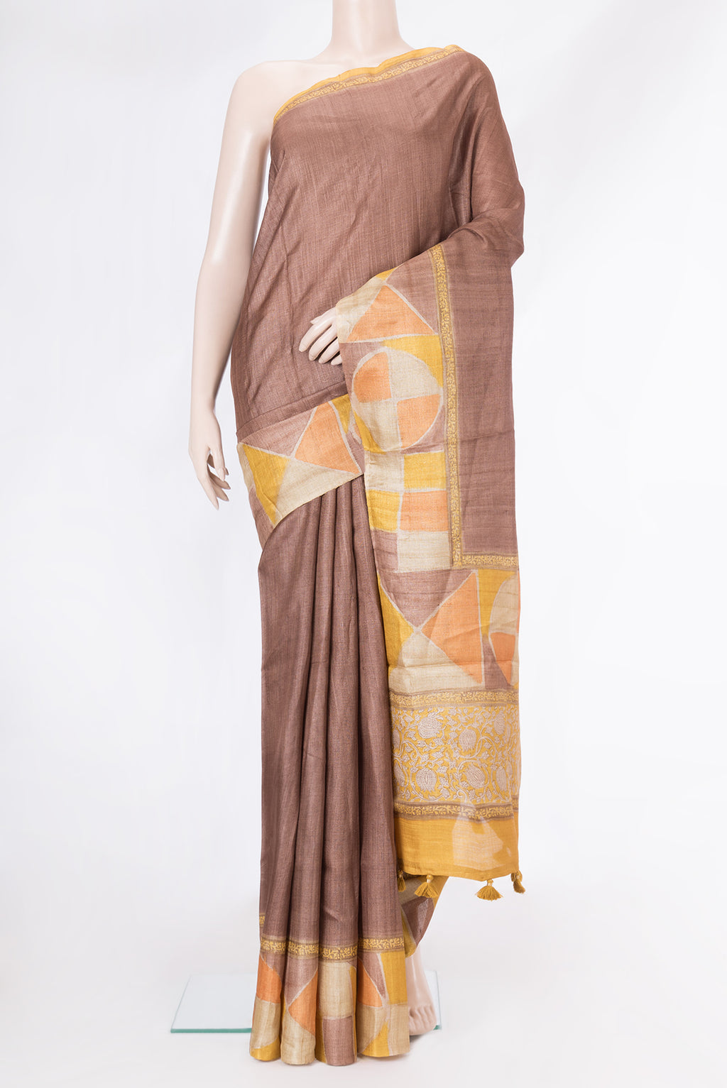 Brown Tussar Silk Saree with Plain Body and Fancy Border.  displayed on a mannequin