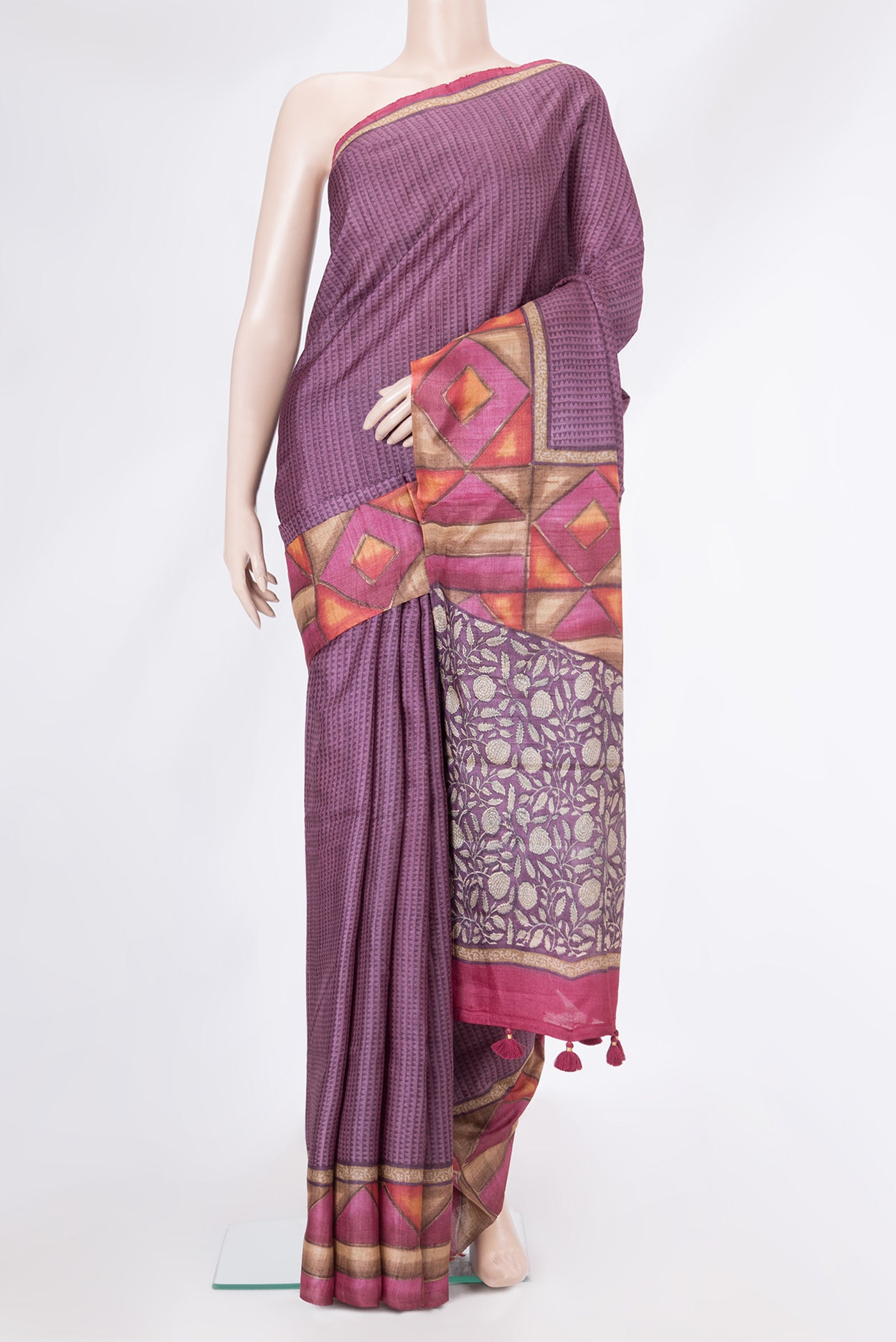 Purple Tussar Silk Saree with Printed design on the body and Fancy Border.  displayed on a mannequin