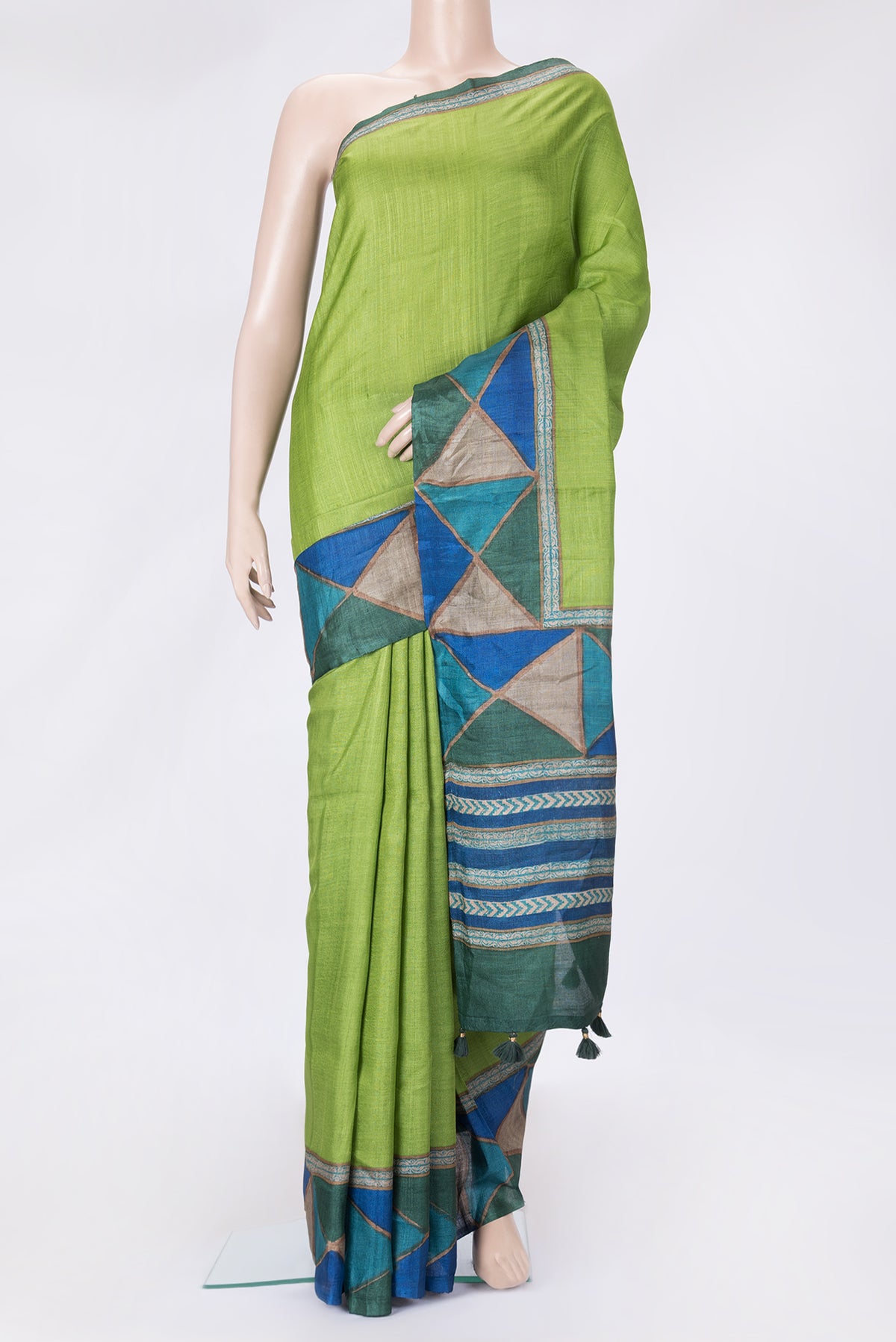 Parrot Green Dual Tone Tussar Silk Saree with Plain Body and Printed Border.  displayed on a mannequin