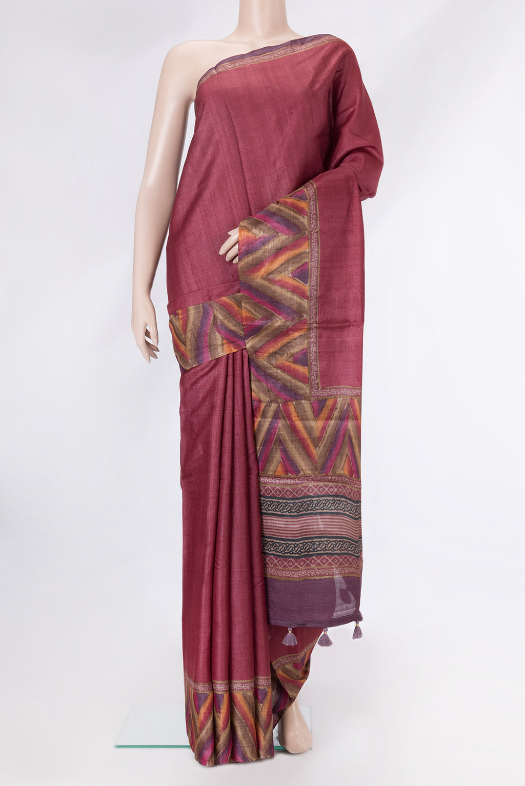 Maroon Dual Tone Tussar Silk Saree with Plain Body and Fancy Border.  displayed on a mannequin