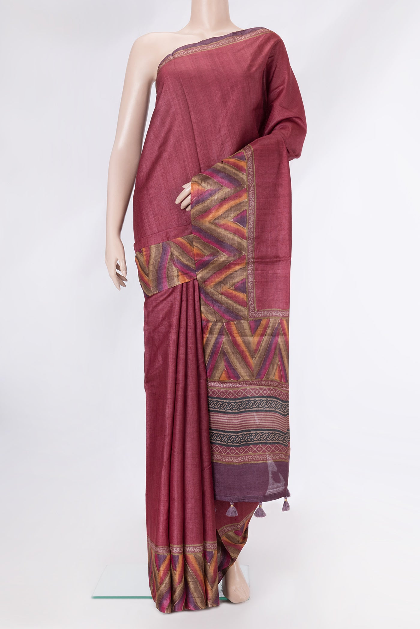 Maroon Dual Tone Tussar Silk Saree with Plain Body and Fancy Border.  displayed on a mannequin