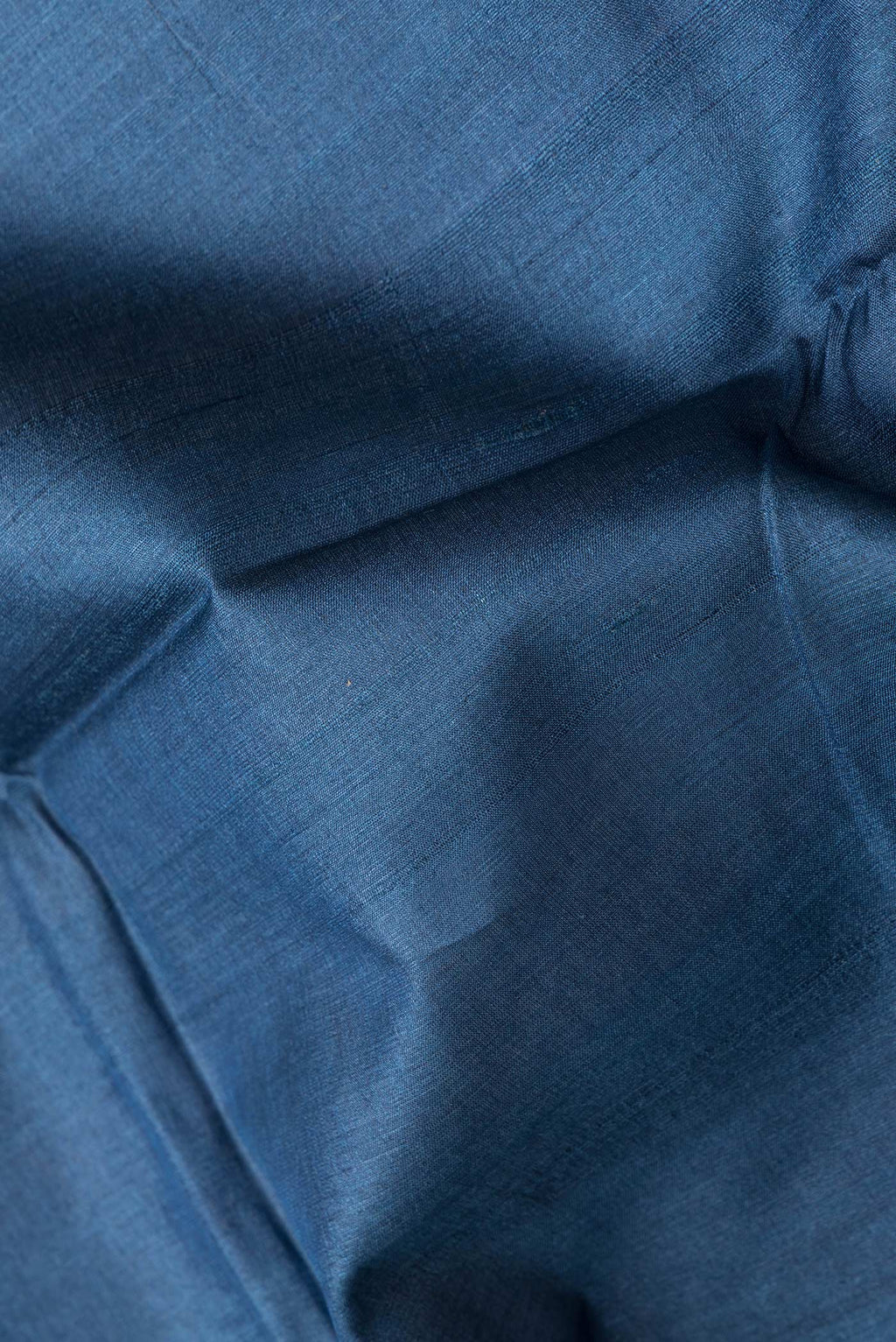 Close up of Navy Blue Dual Tone Tussar Silk Saree with Plain Body and Printed Border.  displaying folds