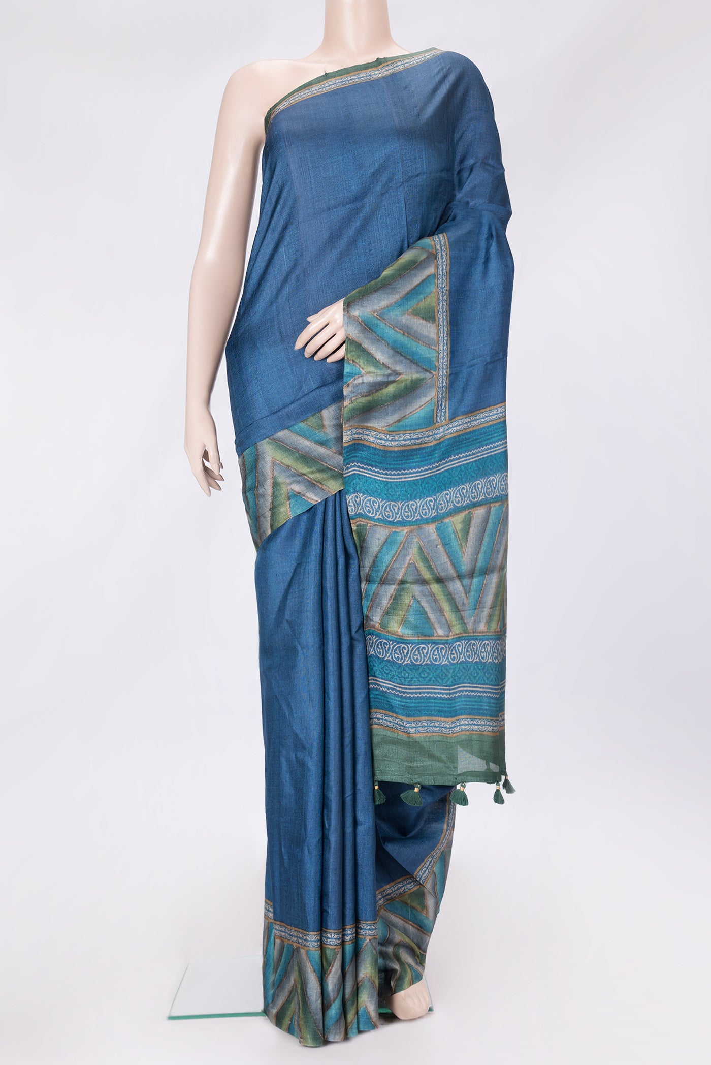 Navy Blue Dual Tone Tussar Silk Saree with Plain Body and Printed Border.  displayed on a mannequin