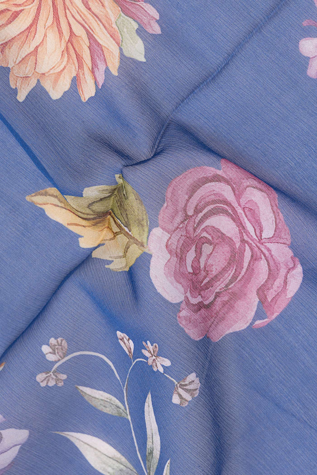 Close up of Blue Mysore Chiffon Saree with Floral Print on the body and Without Border.  displaying folds