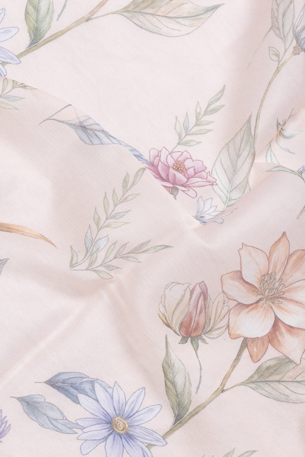 Close up of Golden Peach Dual Tone Chiffon Saree with Printed design on the body and Without Border.  displaying folds