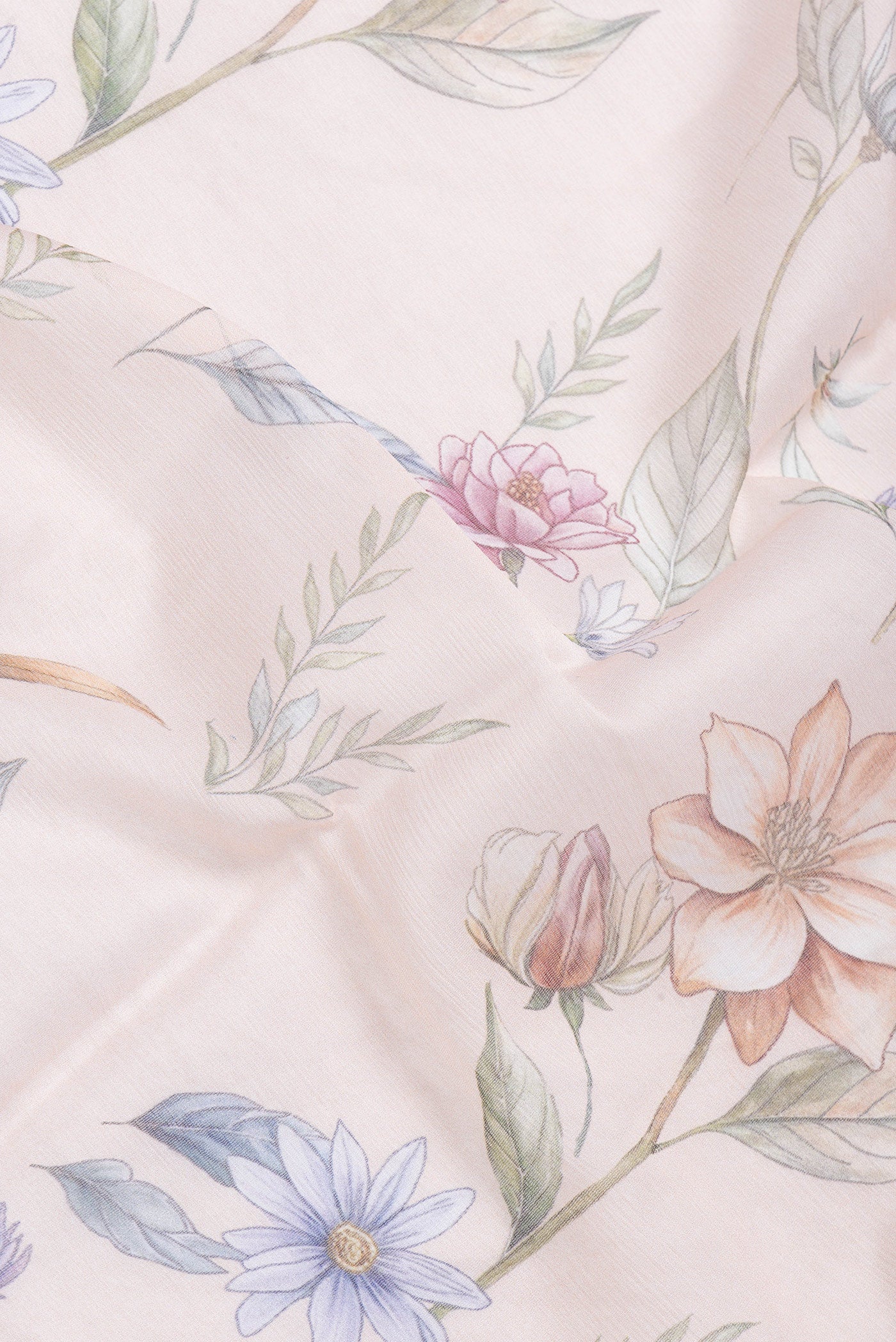 Close up of Golden Peach Dual Tone Chiffon Saree with Printed design on the body and Without Border.  displaying folds