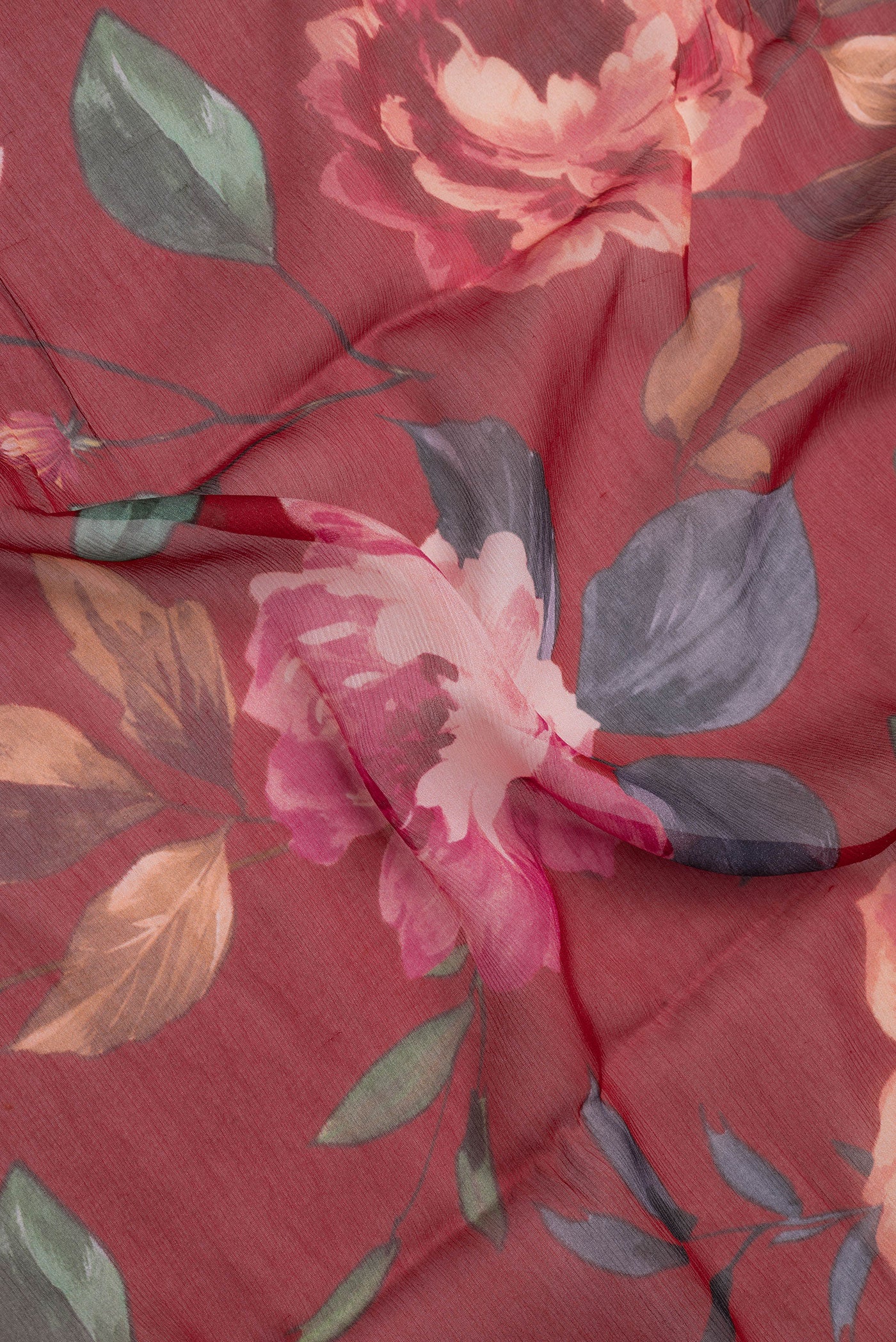 Close up of Red Dual Tone Mysore Chiffon Saree with Printed design on the body and Without Border.  displaying folds