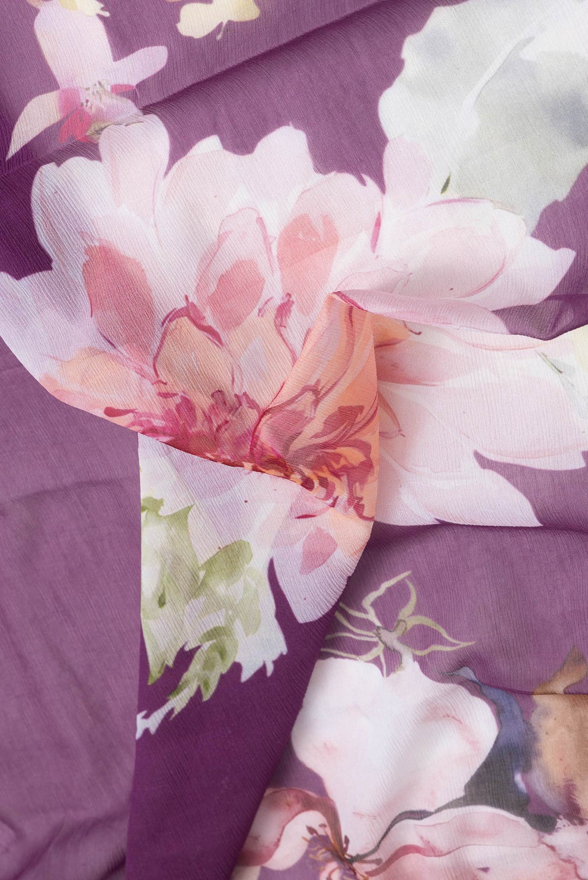 Close up of Purple Dual Tone Mysore Chiffon Saree with Printed design on the body and Without Border.  displaying folds