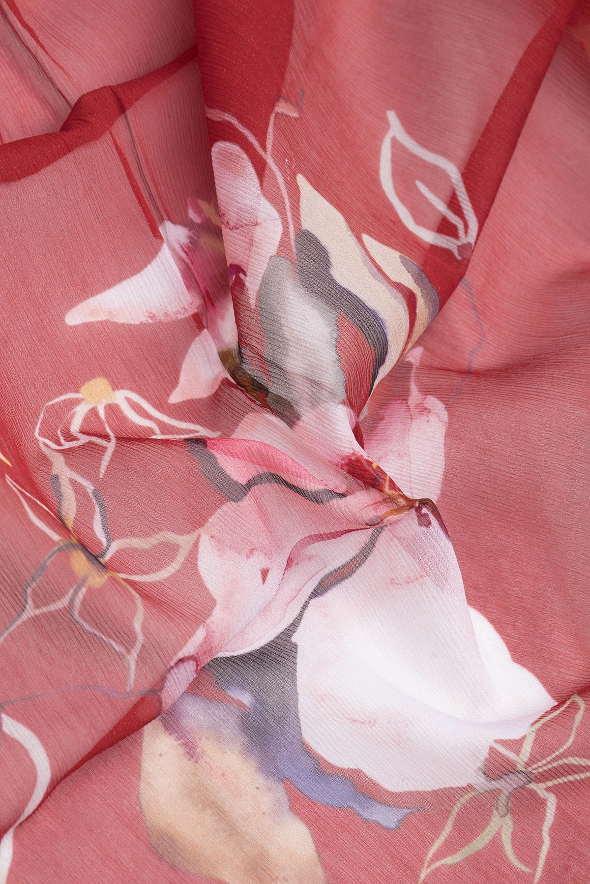 Close up of Maroon Dual Tone Mysore Chiffon Saree with Printed design on the body and Without Border.  displaying folds