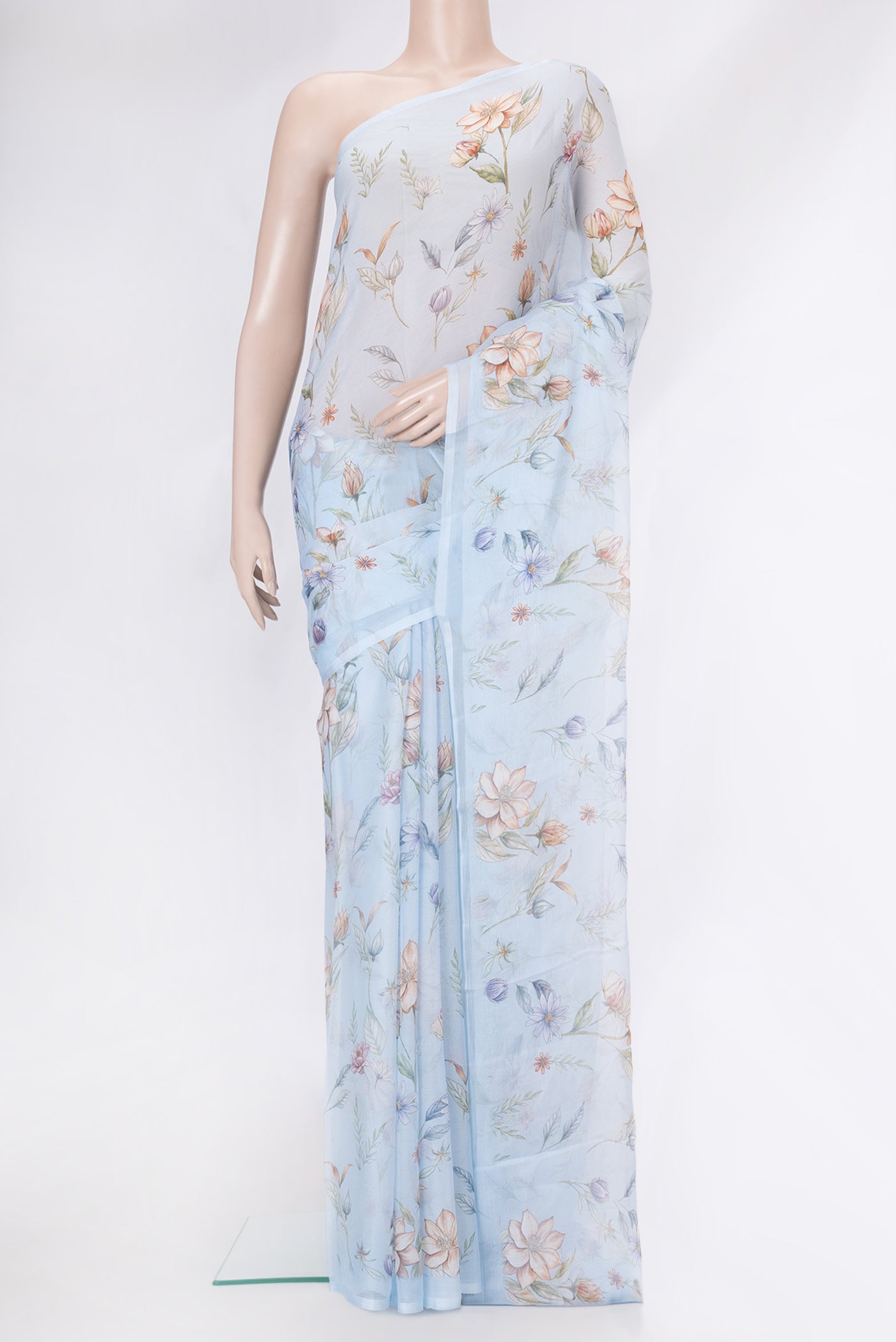Sky Blue Dual Tone Mysore Chiffon Saree with Printed design on the body and Without Border.  displayed on a mannequin