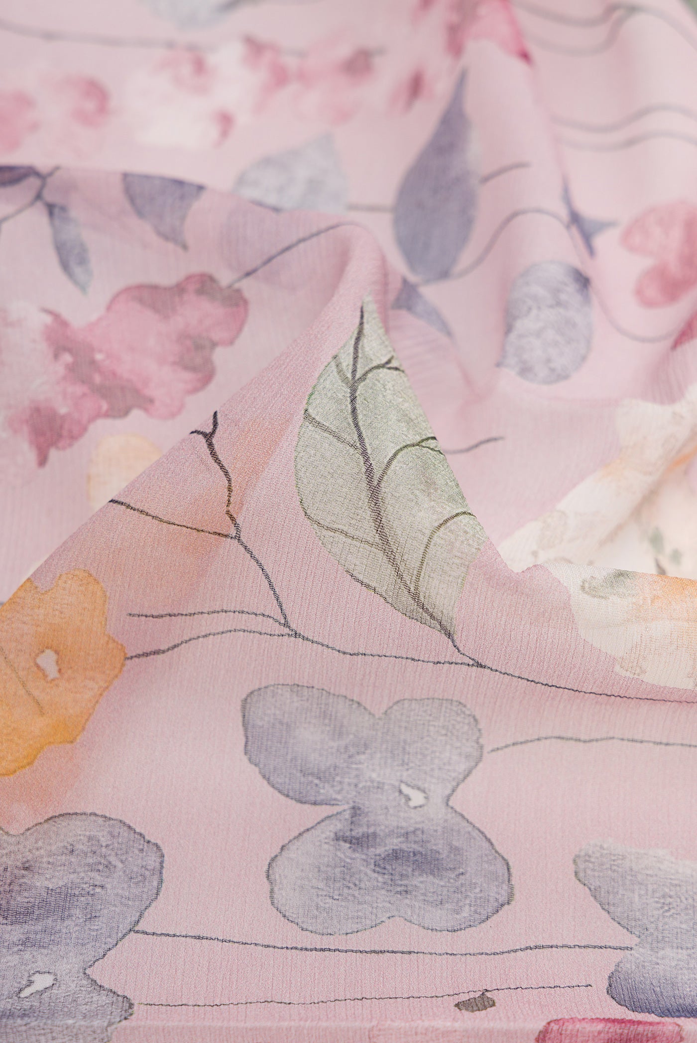 Close up of Pink Dual Tone Mysore Chiffon Saree with Printed design on the body and Plain Border.  displaying folds