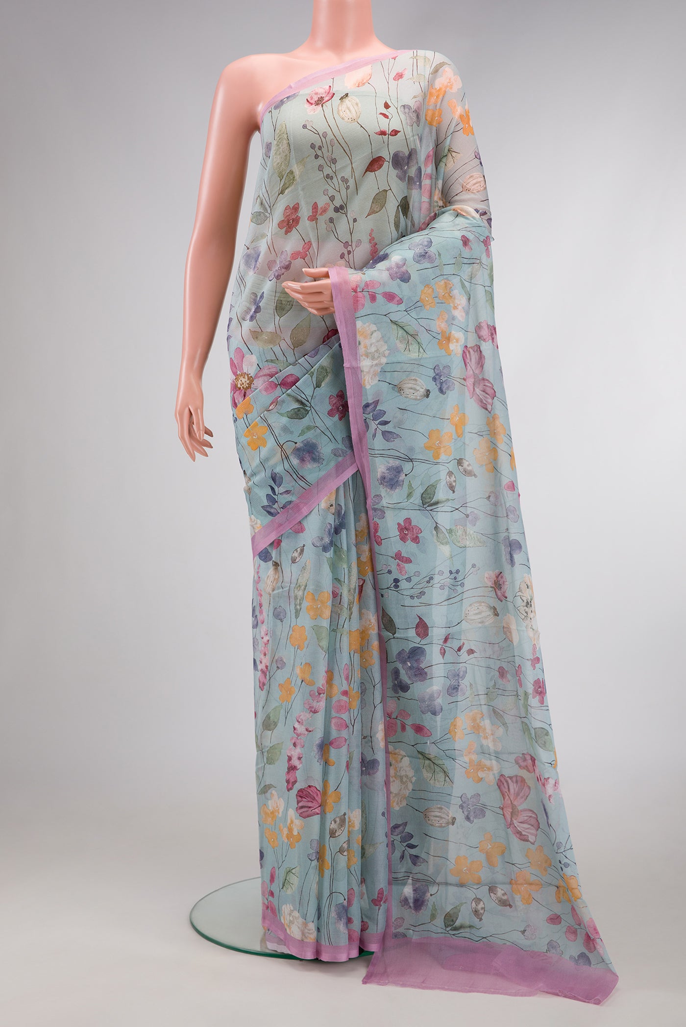 Sea Green Dual Tone Mysore Chiffon Saree with Printed design on the body and Plain Border.  displayed on a mannequin