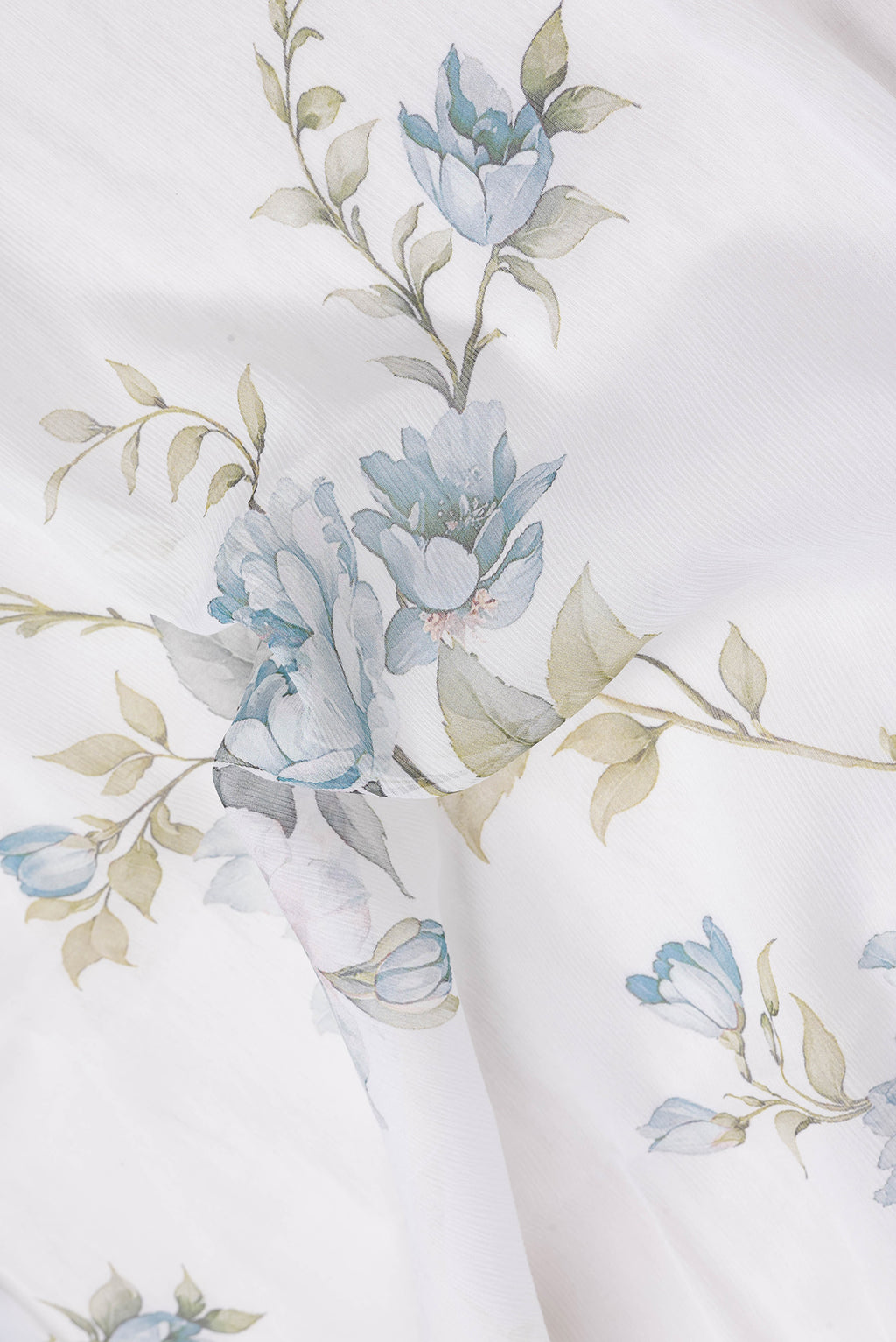 Close up of Off White Dual Tone Mysore Chiffon Saree with Printed design on the body and Plain Border.  displaying folds