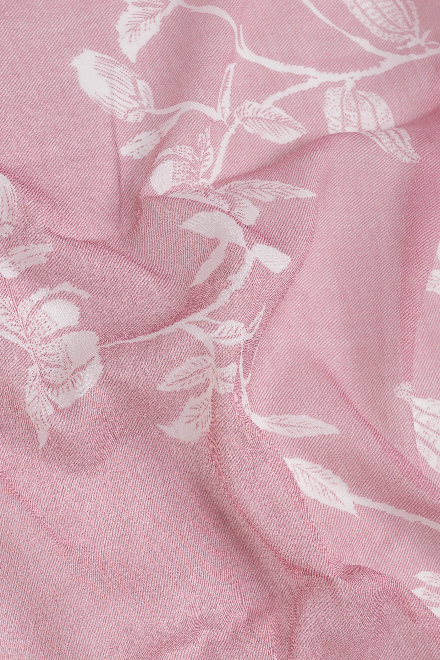Close up of Pink Dual Tone Mysore Chiffon Saree with Printed design on the body and Without Border.  displaying folds