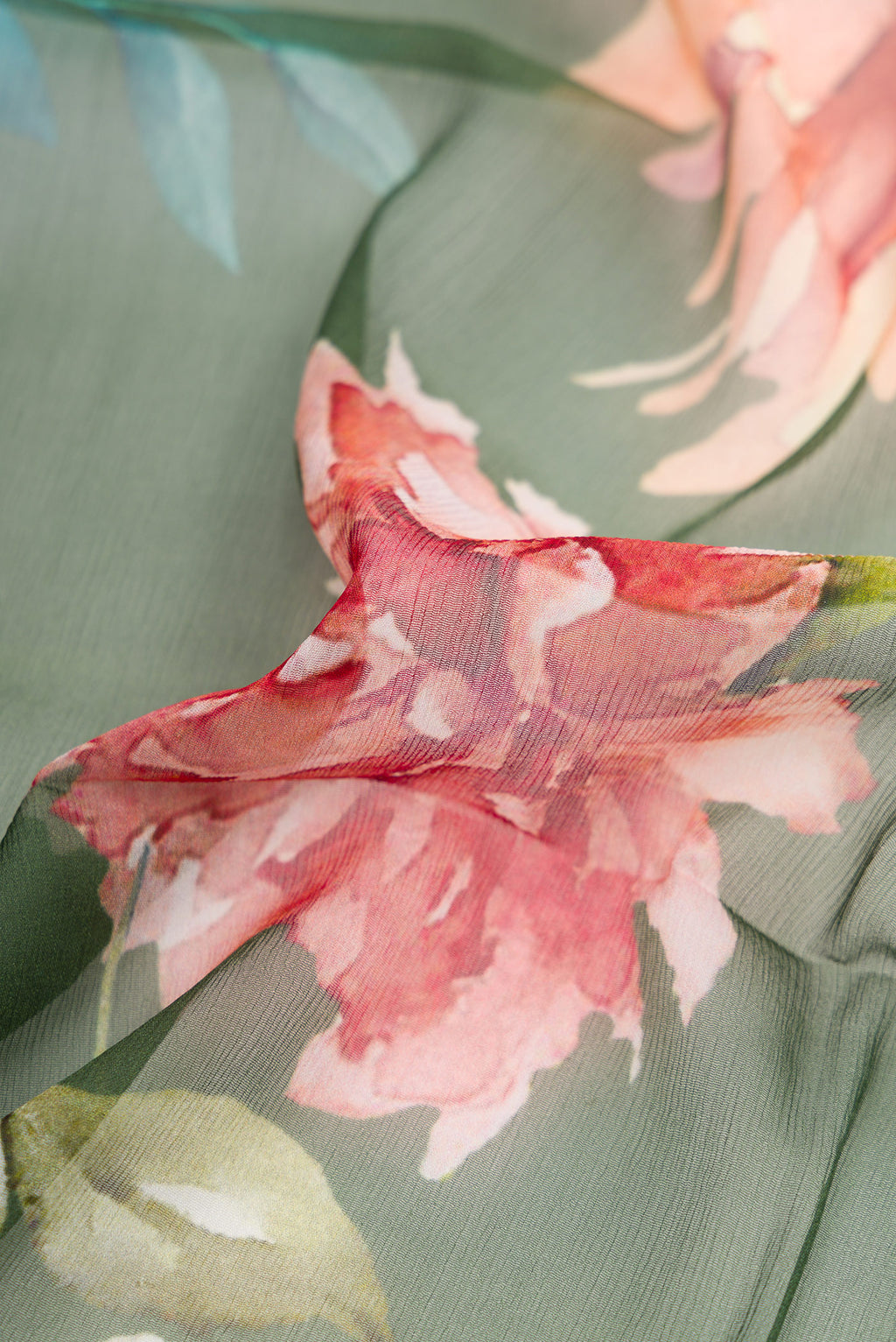 Close up of Green Dual Tone Mysore Chiffon Saree with Printed design on the body and Without Border.  displaying folds