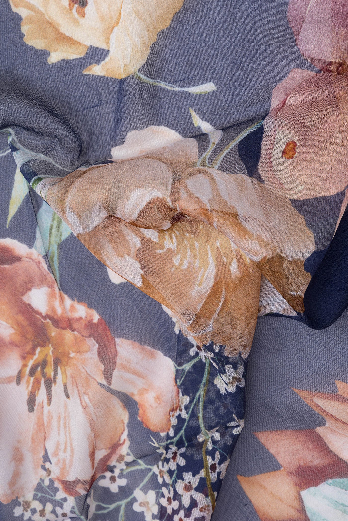 Close up of Navy Blue Mysore Chiffon Saree with Printed design on the body and Without Border.  displaying folds
