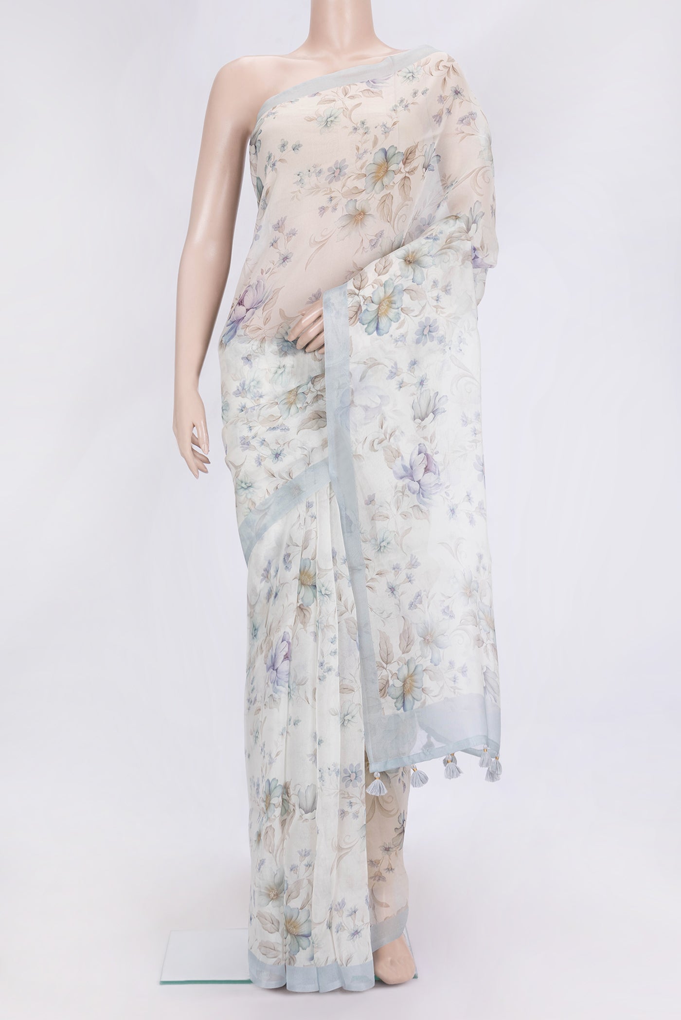 Beige Dual Tone Organza Silk Saree with Printed design on the body and Plain Border.  displayed on a mannequin