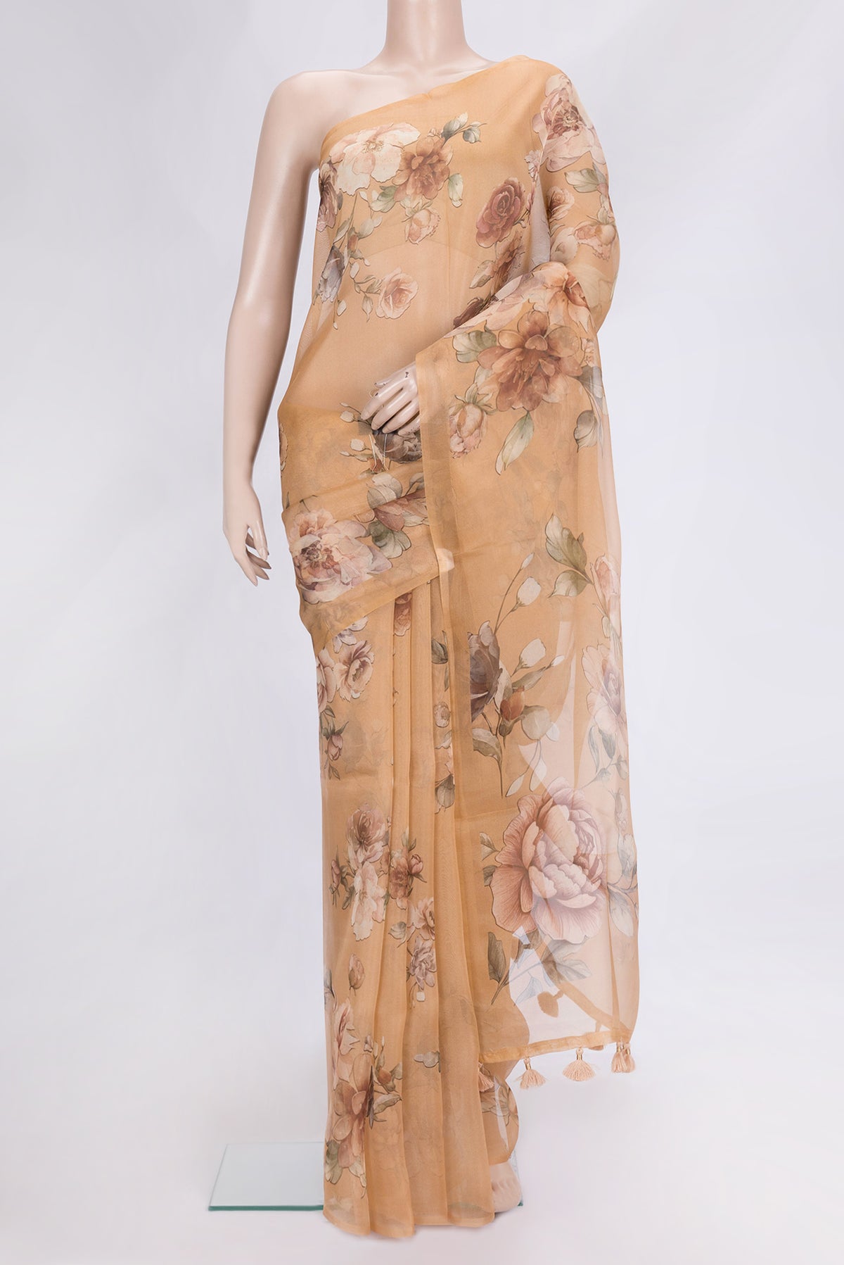 Golden Peach Dual Tone Organza Silk Saree with Printed design on the body and Without Border.  displayed on a mannequin
