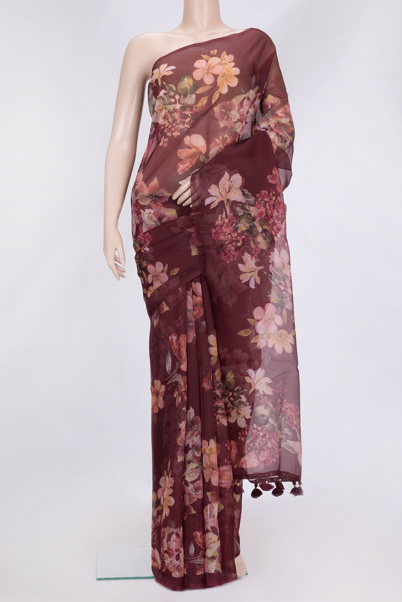 Maroon Dual Tone Organza Silk Saree with Printed design on the body and Without Border.  displayed on a mannequin