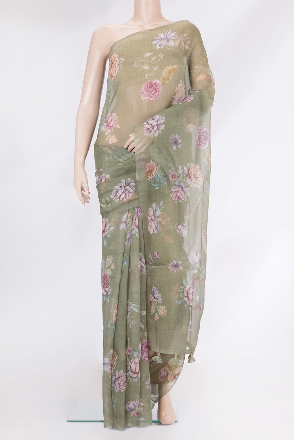 Sage Green Organza Silk Saree with Floral Print on the body and Without Border.  displayed on a mannequin