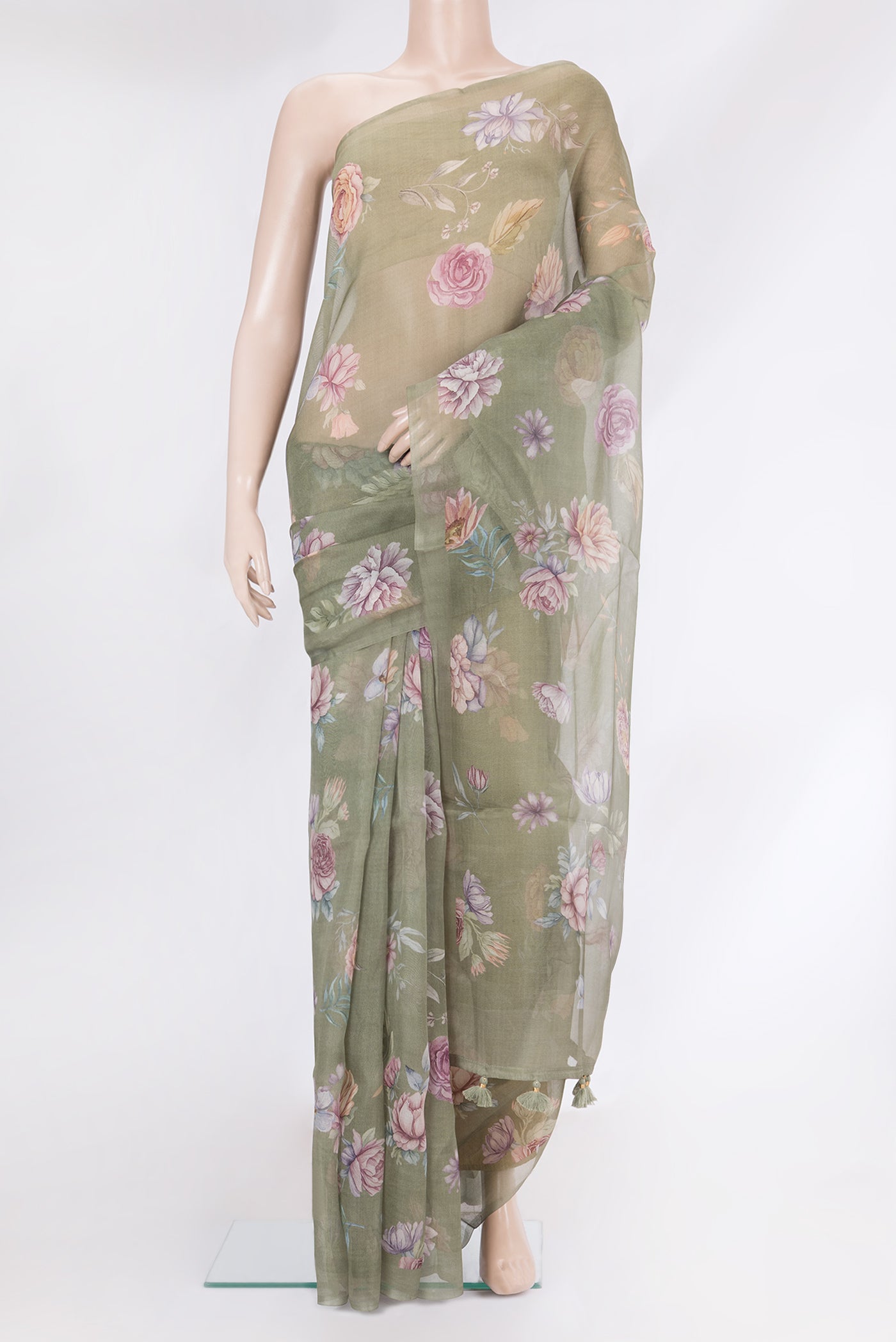 Sage Green Organza Silk Saree with Floral Print on the body and Without Border.  displayed on a mannequin
