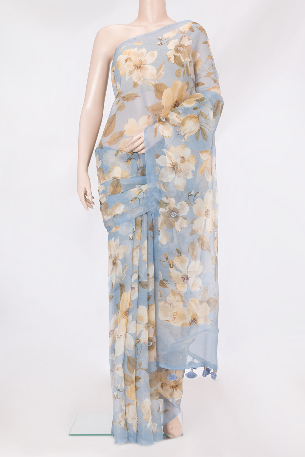 Light Blue Organza Silk Saree with Floral Print on the body and Without Border.  displayed on a mannequin
