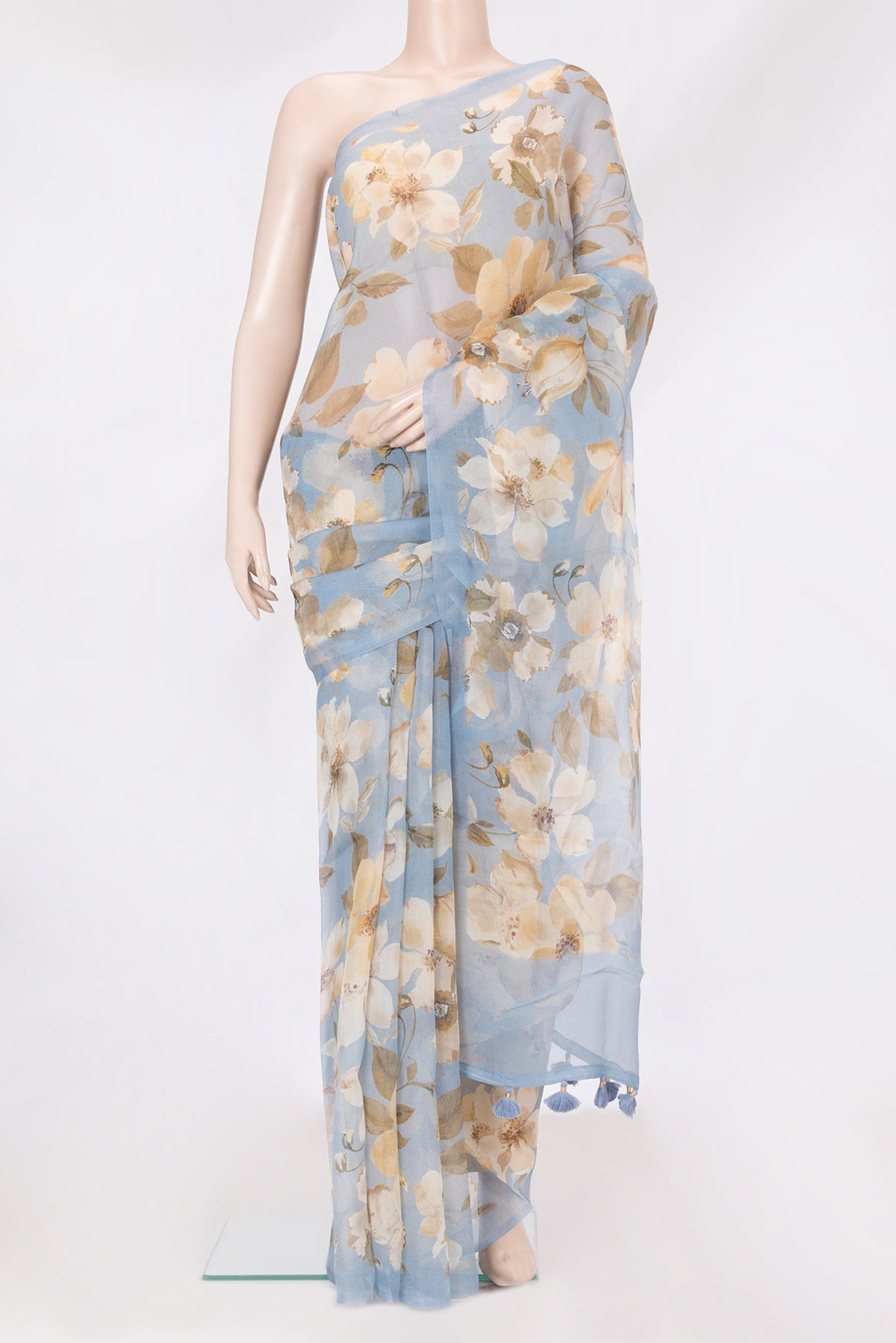 Light Blue Organza Silk Saree with Floral Print on the body and Without Border.  displayed on a mannequin