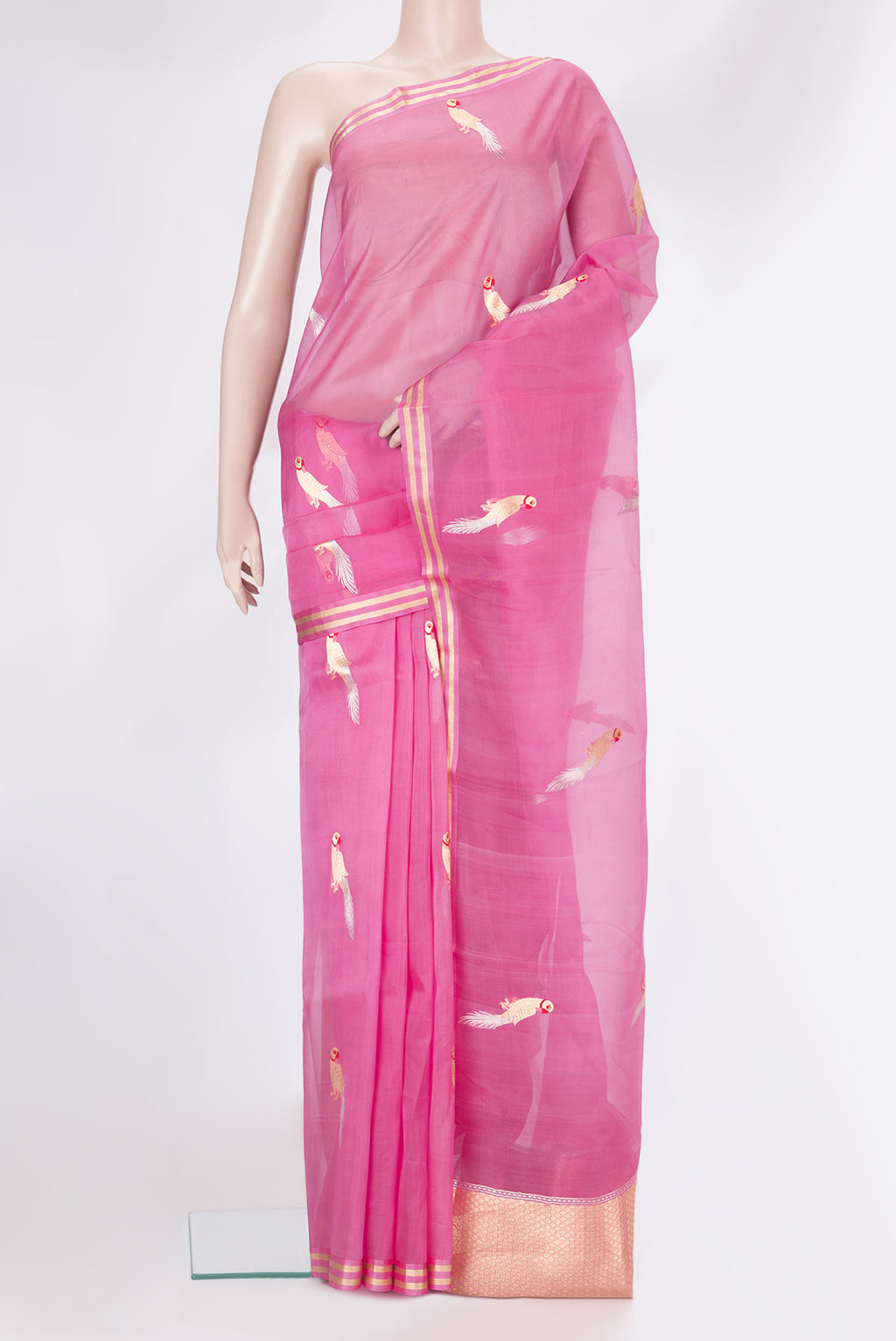 Pink Organza Silk Saree with Zari And Thread Butta on the body and Zari Border.  displayed on a mannequin
