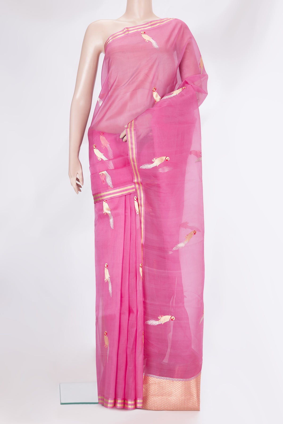 Pink Organza Silk Saree with Zari And Thread Butta on the body and Zari Border.  displayed on a mannequin