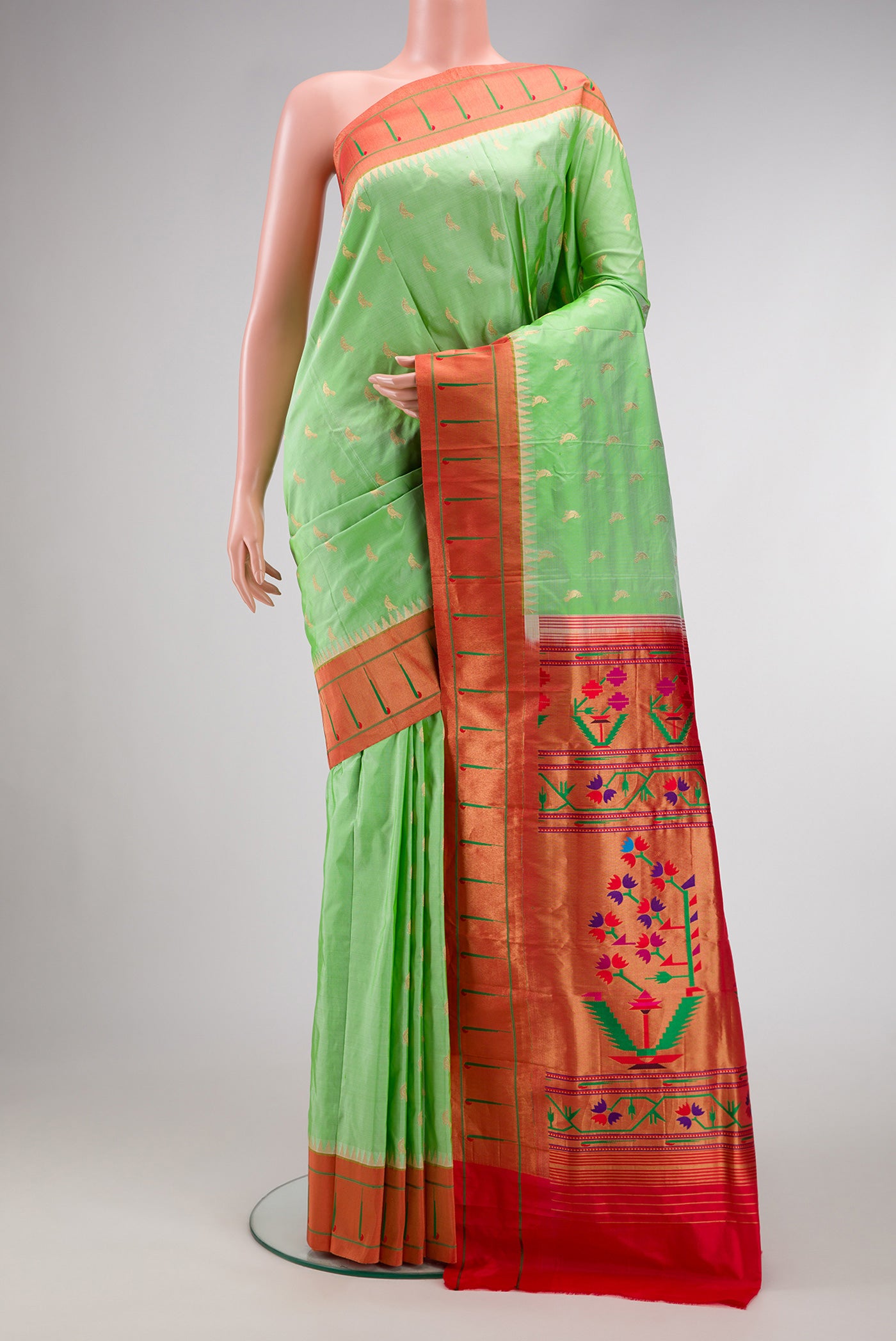 Pista Green Dual Tone Paithani Silk Saree with Zari Butta on the body and Paithani Border.  displayed on a mannequin