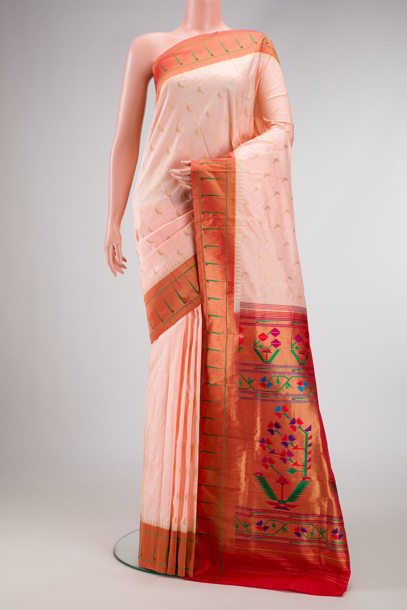 Peach Dual Tone Paithani Silk Saree with Zari Butta on the body and Paithani Border.  displayed on a mannequin